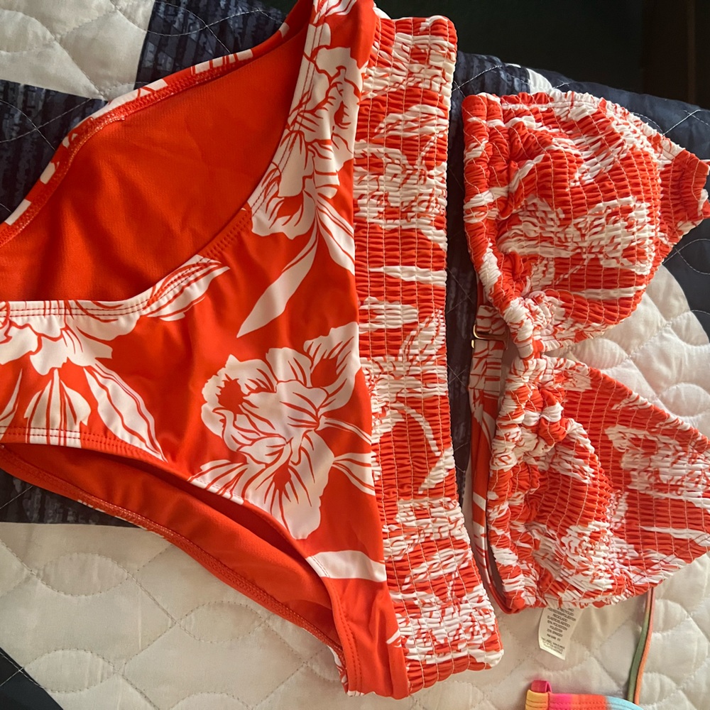 New orange and white bikini size large it has never been worn. Too big for me.